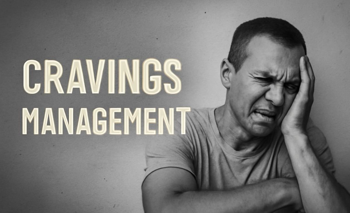 Man with light skin, grimacing and holding his head, struggling with cravings, against a cracked, off-white wall with bold text 'Cravings Management' on the left.